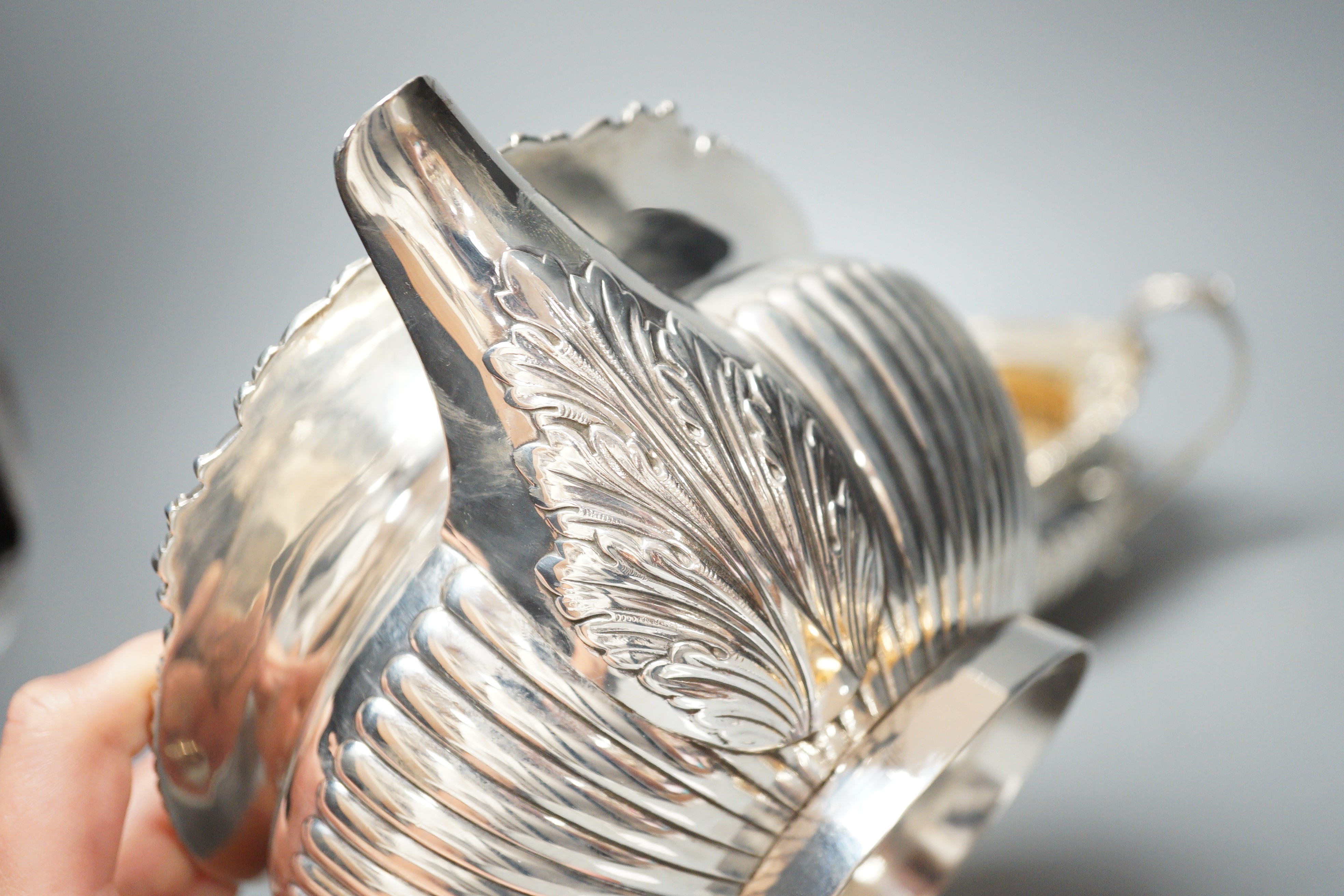 A late Victorian demi-fluted silver circular three piece tea set, Walter & John Barnard, London, 1895